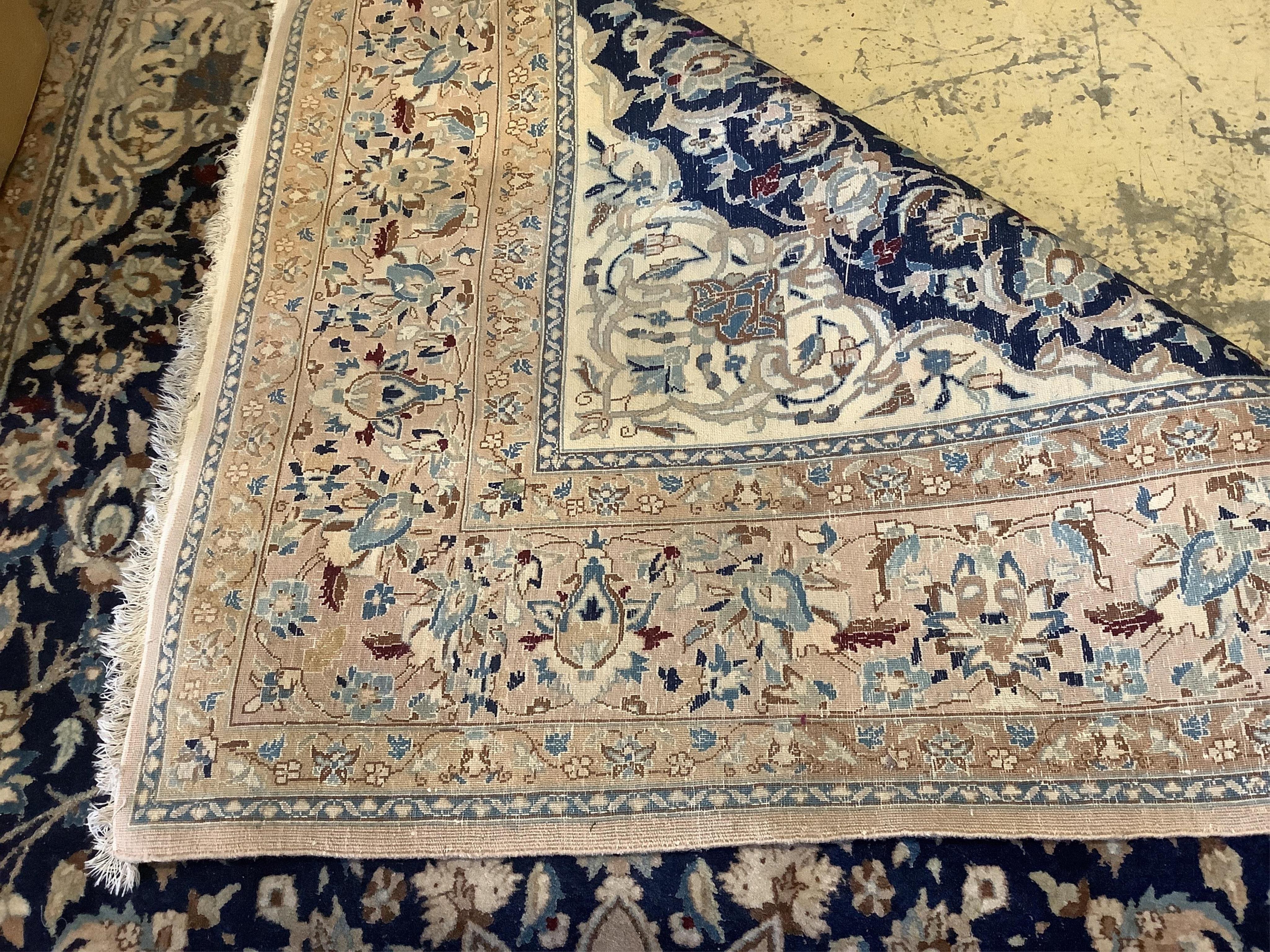 A Nain blue ground carpet, 277 x 174cm. Condition - fair to good